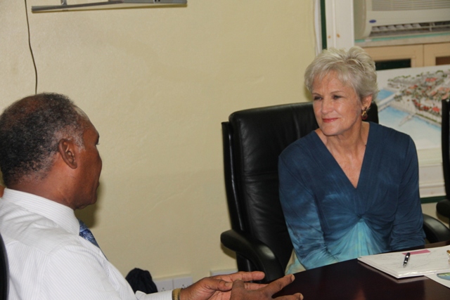 Premier of Nevis and Minister of Education Hon. Vance Amory and California based two-time Olympian Marilyn King at the Nevis Island Administration (NIA) conference room at Bath Hotel on August 25, 2015